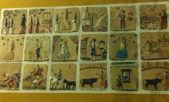 Relief ceramic tiles showing Spanish traditions such as bullfighting and flamenco. In El Pimpi, Malaga
