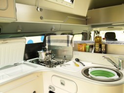 The compact kitchen, which comes complete with fridge, gas cooker and sink. The compact kitchen, which comes complete with fridge, gas cooker and sink.
