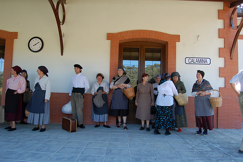 A group of townspeople wait at the train station. Photo: Javier Polo A group of townspeople wait at the train station. Photo: Javier Polo