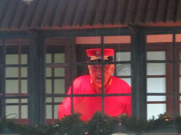 Resplendent in his scarlet uniform, the station master keeps an eye on the action from his signal box. Resplendent in his scarlet uniform, the station master keeps an eye on the action from his signal box.