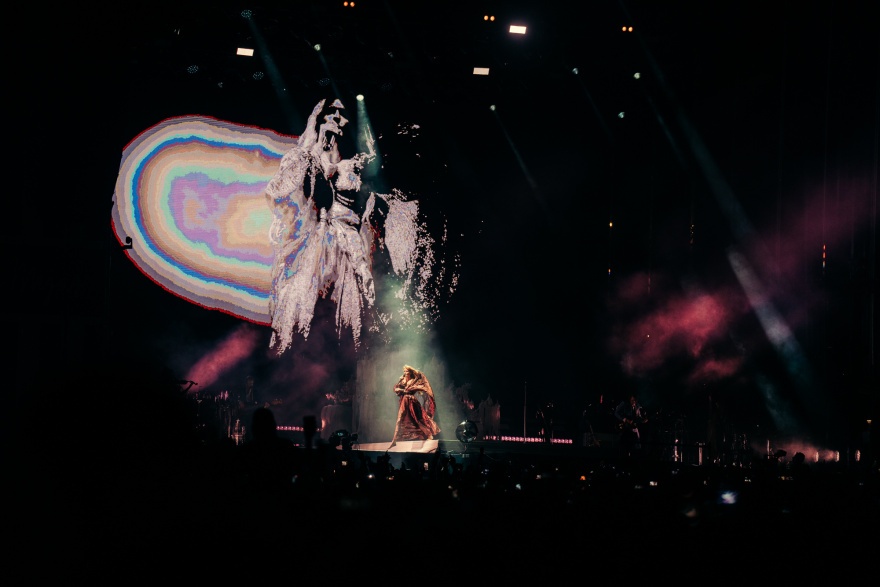 Florence and the Machine, barefoot and clad in a long, sparkly, copper gown with a flowing cape to match. © Sharon Lopez