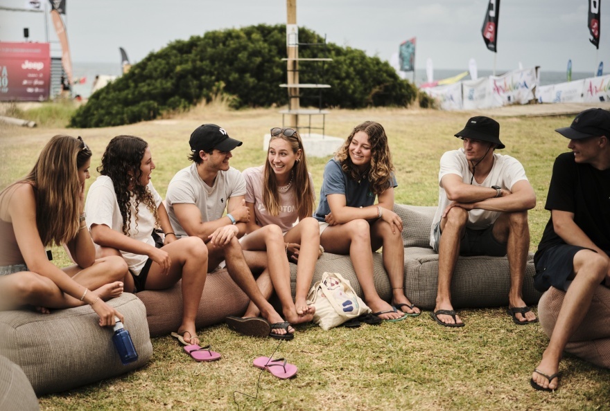 GWA Wingfoil World Cup Tarifa 2025 - Competitors chatting - Nia Suardiaz, defending champion 2nd from left. (c) Samual Cadenas