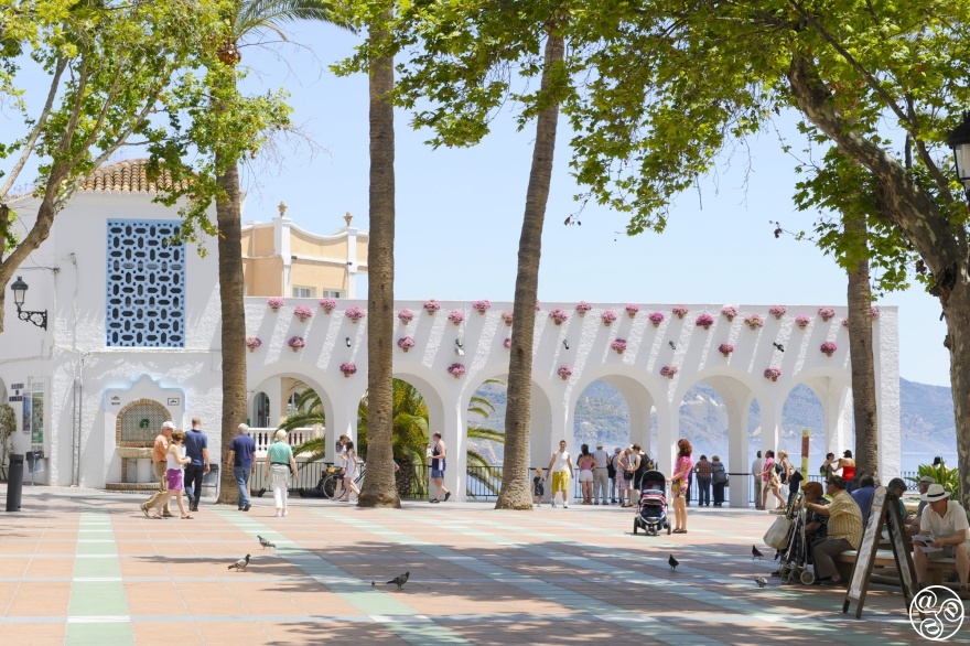 Arches bathed in sunlight, flower pots in bloom — Nerja’s Balcón de Europa © Michelle Chaplow