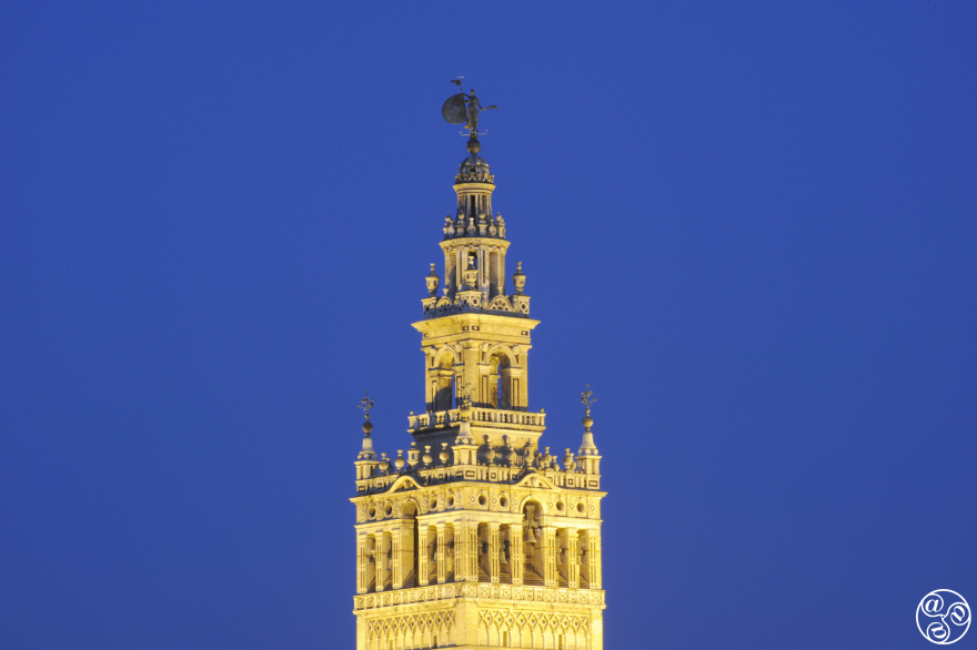 The Giralda Tower stands as Seville's timeless guardian, where centuries of history meet the endless blue sky. © Michelle Chaplow