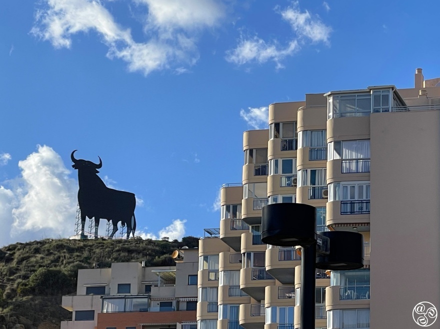 Contemporary architecture with the Osbourne Bull standing around on the hill top in Torreblanca      © Michelle Chaplow