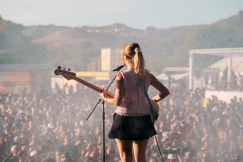 Alicia Ros, vocals and bass guitarist of female trio pop band Cariño on the Victoria stage © Sharon Lopez