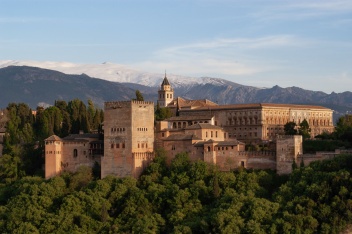 The Alhambra glows warm against the cool, snow-dusted Sierra Nevada — an iconic Granada view that captures the spirit of Andalucía. © Michelle Chaplow