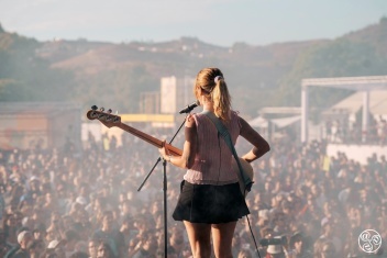 Alicia Ros, vocals and bass guitarist of female trio pop band Cariño on the Victoria stage © Sharon Lopez