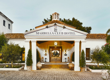 The iconic entrance of Marbella Club, where timeless elegance  meets coastal charm.© Marbella Club