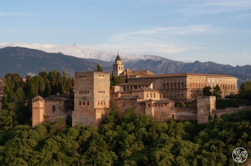 The Alhambra glows warm against the cool, snow-dusted Sierra Nevada — an iconic Granada view that captures the spirit of Andalucía. © Michelle Chaplow