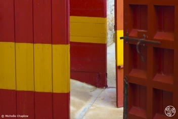 The emblematic red and yellow doors of Spain´s bullrings © Michelle Chaplow