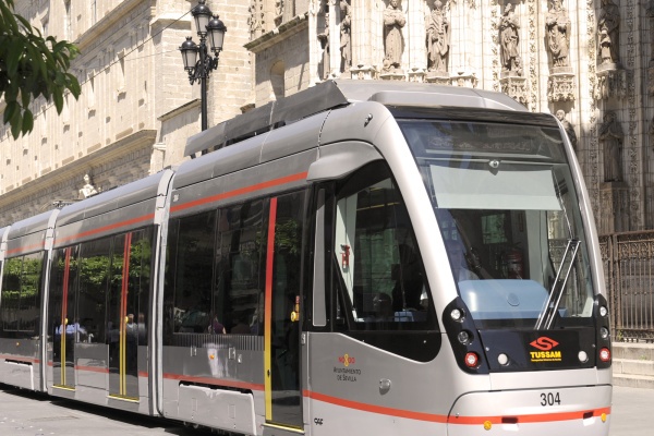 A tram passing Seville Cathedral through centuries of history. © Michelle Chaplow