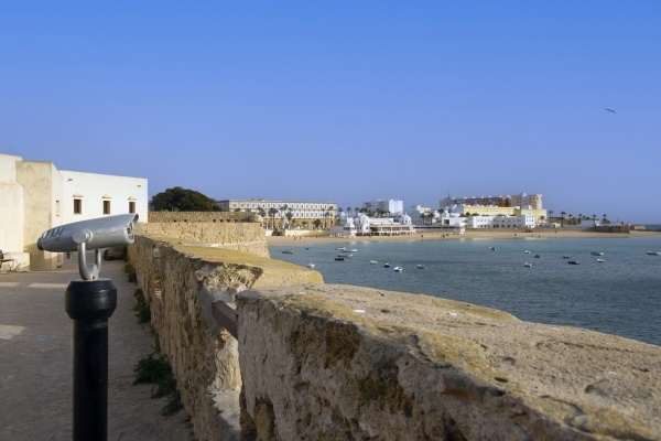 La Caleta Beach seen from the city walls of Cádiz — a serene stretch of sand framed by history and the Atlantic breeze © Michelle Chaplow