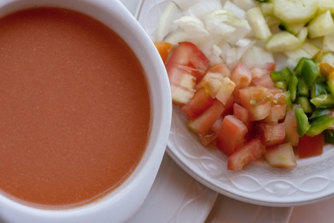 Gazpacho with garnishes of diced onions, cucumber tomatoes and green peppers, a  delicious cold soup that is just full of nutrients. (c) Michelle Chaplow
