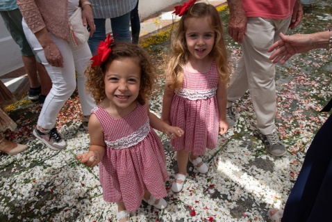 The little children are so excited to be able to walk and play in the petals of the flowers after the procession has gone by. © Michelle Chaplow