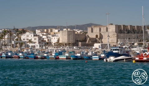 Impressive view from the sea - towering over the old town, the castle is a 1000-year-old Moorish fortification. © Michelle Chaplow