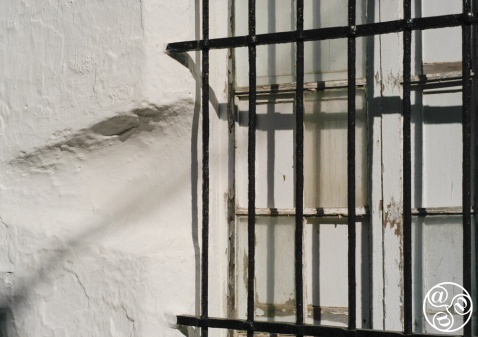 The traditional Andalucian window. The cut within the wall was to allow girls from the "safety" of their home to chat and whisper to passers by and potential suitors. Windows and life in Andalucia have come on a long way! © Michelle Chaplow The traditional Andalucian window. The cut within the wall was to allow girls from the "safety" of their home to chat and whisper to passers by and potential suitors. Windows and life in Andalucia have come on a long way! © Michelle Chaplow
