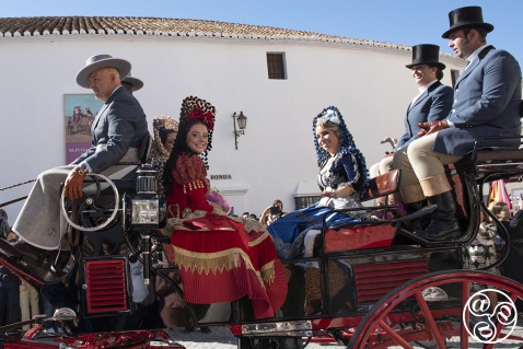 Goya's ladies in a horse drawn carriage, traditionally dressed, wearing ornate dresses and mantillas © Michelle Chaplow