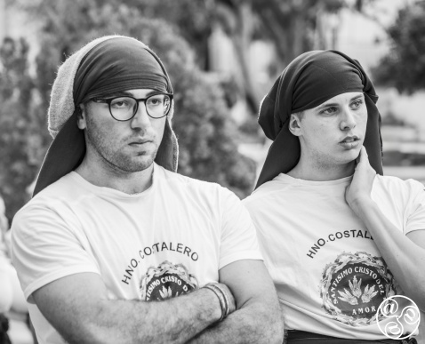 Two costaleros pause in quiet reflection © Michelle Chaplow Two costaleros pause in quiet reflection © Michelle Chaplow