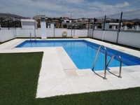 Cozy apartment with a rooftop pool near the beach