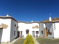 Cave house with private terrace on a small complex